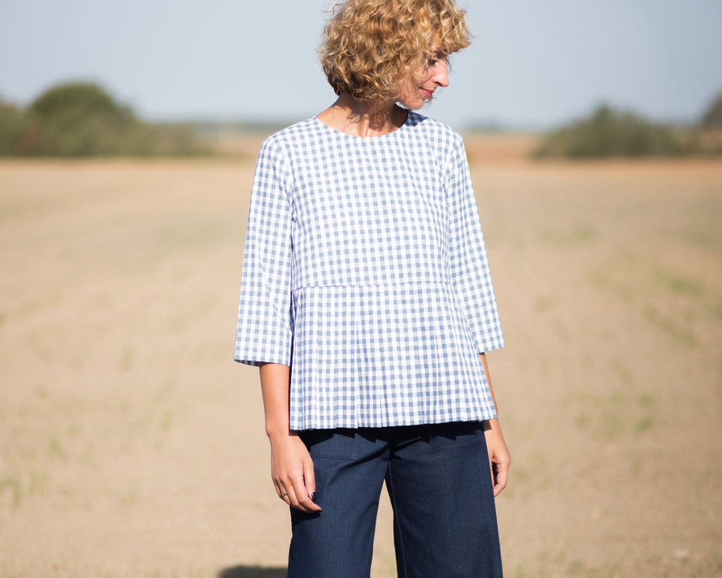Checkered cotton blouse with a pleated peplum
