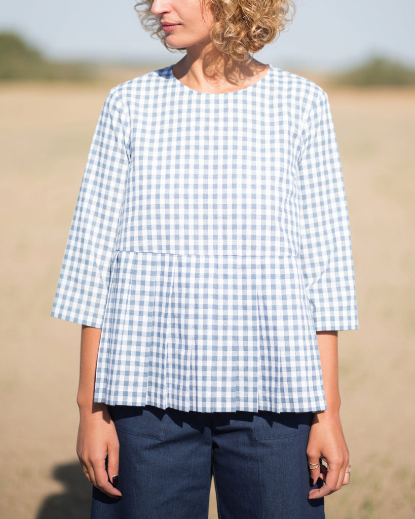 Checkered cotton blouse with a pleated peplum - Image 1