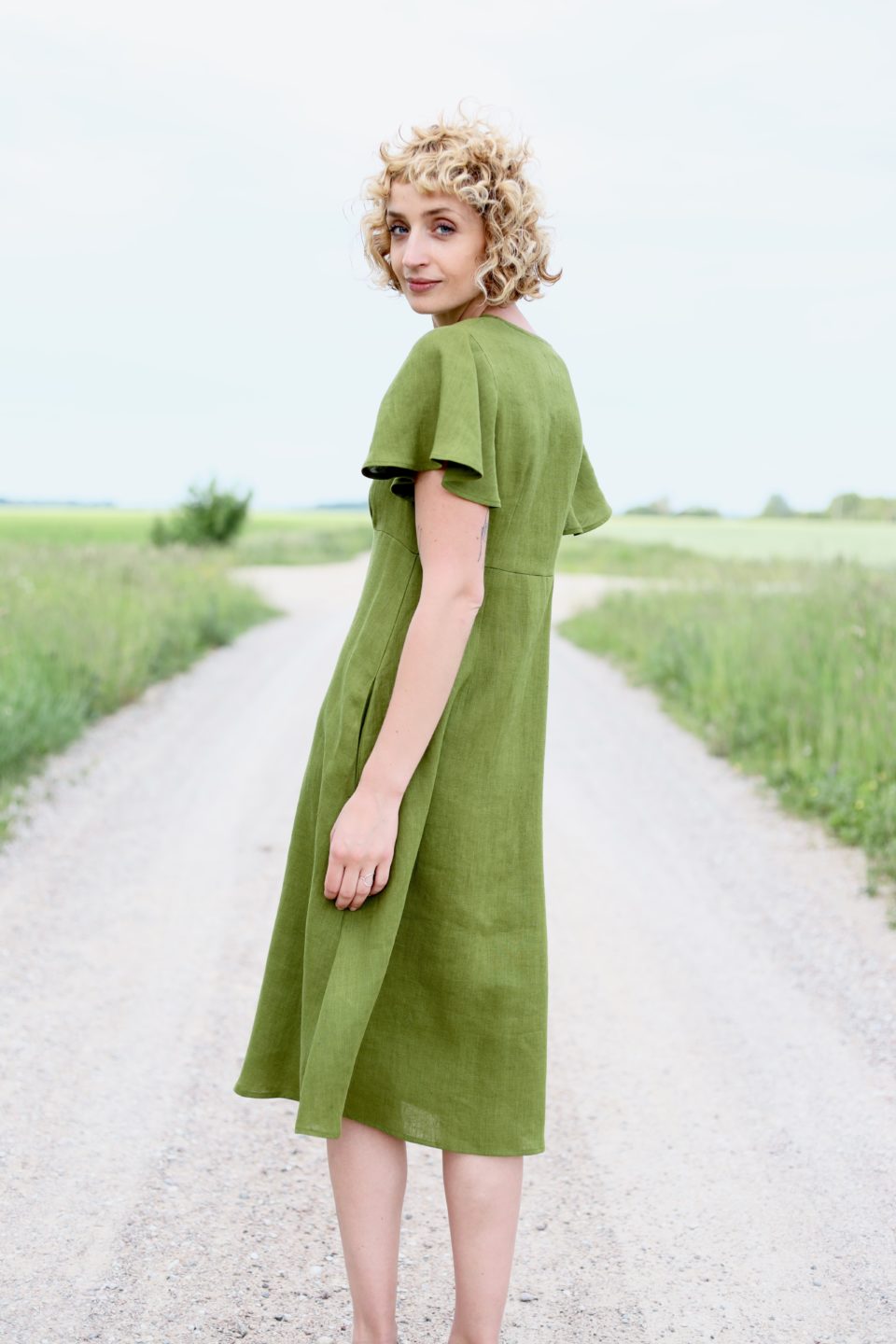 Linen dress with frill sleeves in moss green color - Image 1
