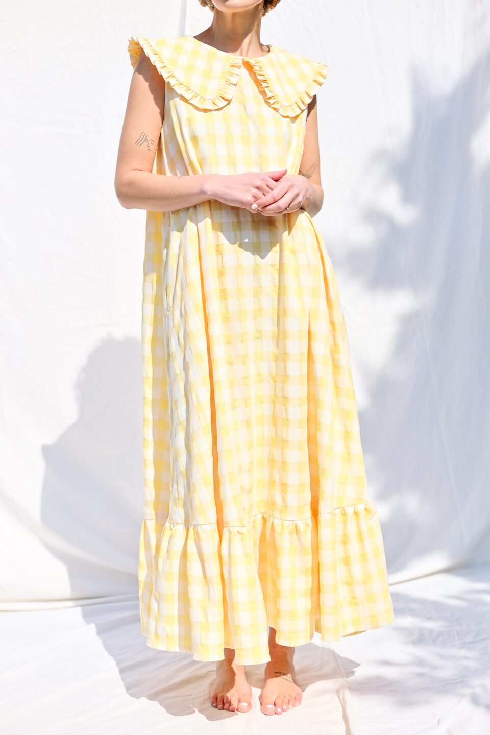 Collared sleeveless summer dress in yellow seersucker checks - Image 1