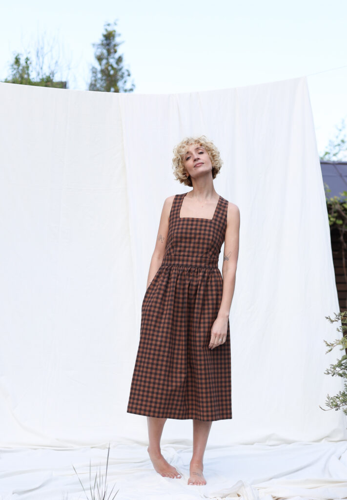 Organic cotton gingham apron dress - Image 1