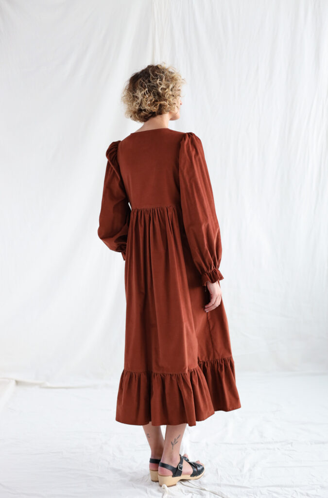 Needlecord long sleeve dress in brick color - Image 1